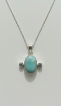 Silver pendant necklace with blue topaz