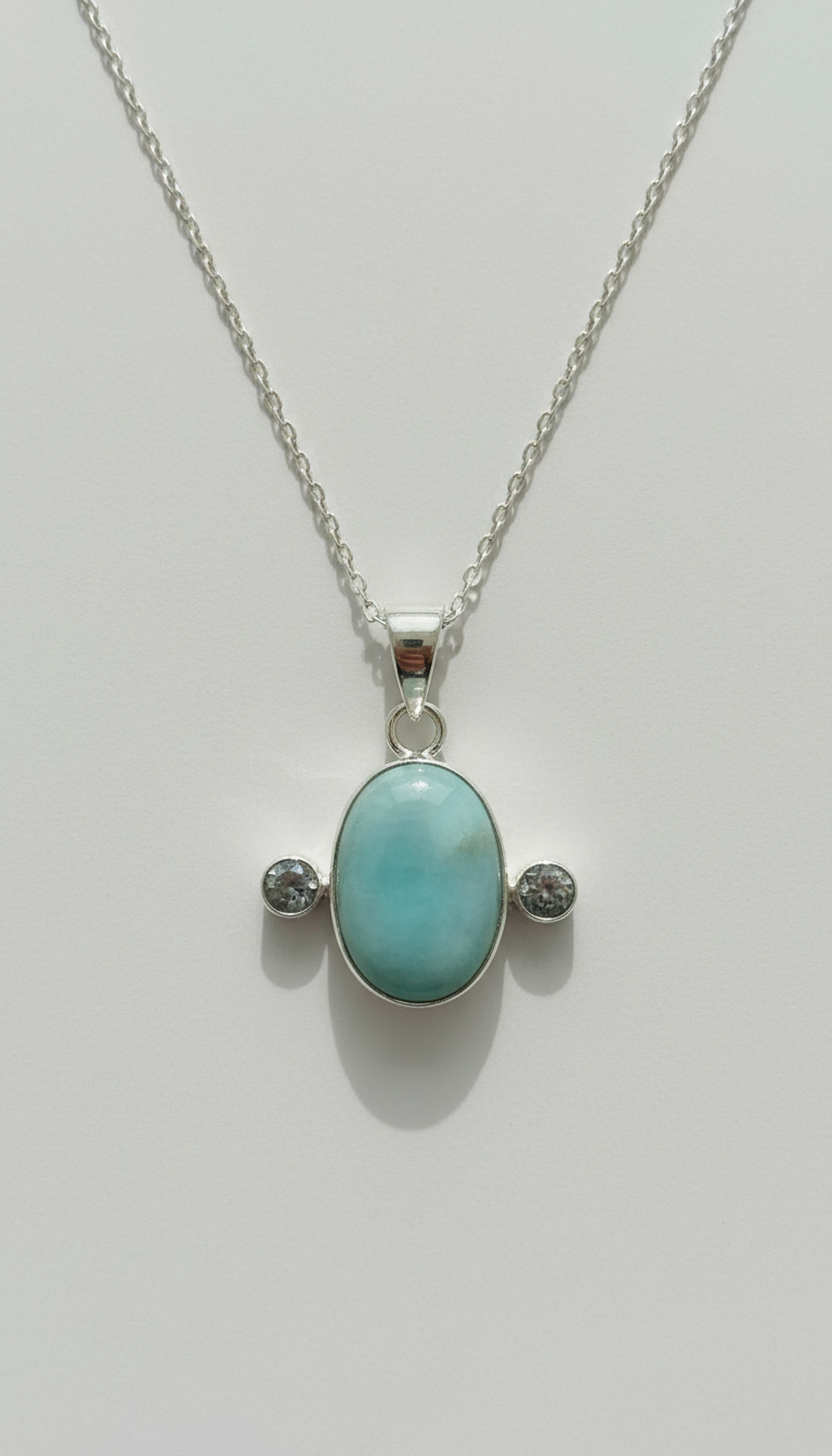 Silver pendant necklace with blue topaz